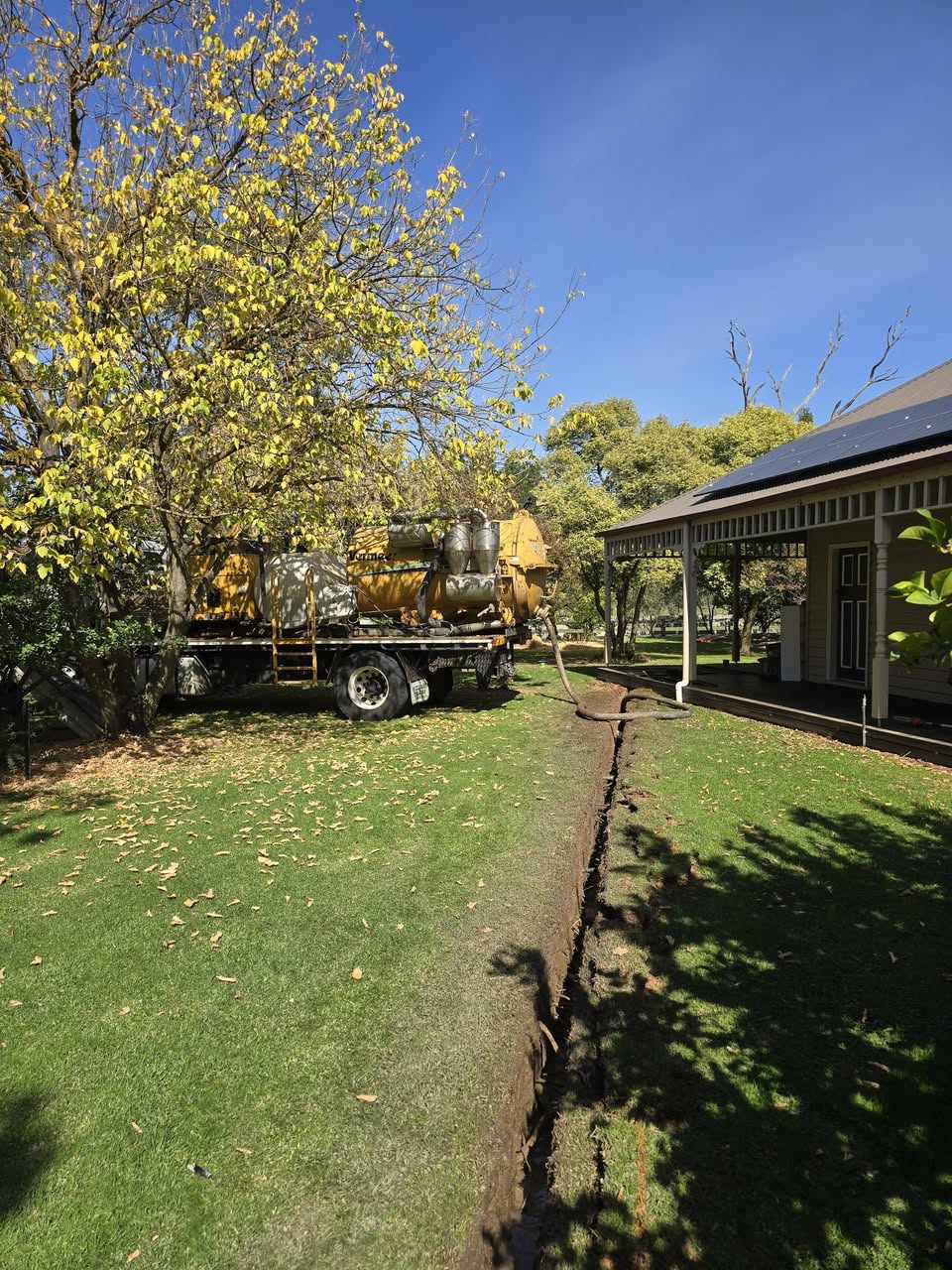 Vac truck on a heritage-home job — non-destructive digging where the services are unknown.